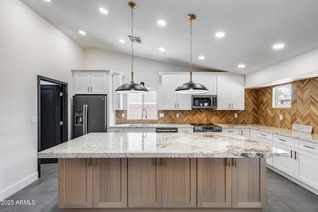 3011 E John Cabot Dr, Phoenix, AZ 85032 - kitchen with stainless steel appliances, lofted ceiling, a kitchen island, tasteful backsplash, and recessed lighting
