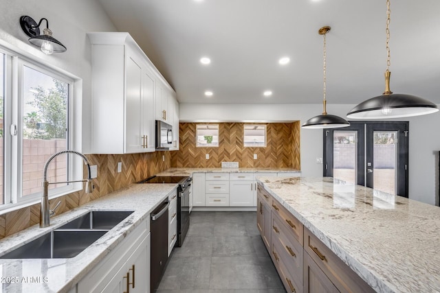 3011 E John Cabot Dr, Phoenix, AZ 85032 - kitchen featuring appliances with stainless steel finishes, a sink, plenty of natural light, white cabinets, and recessed lighting