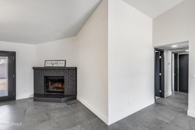 3011 E John Cabot Dr, Phoenix, AZ 85032 - unfurnished living room featuring baseboards, a brick fireplace, and a high ceiling