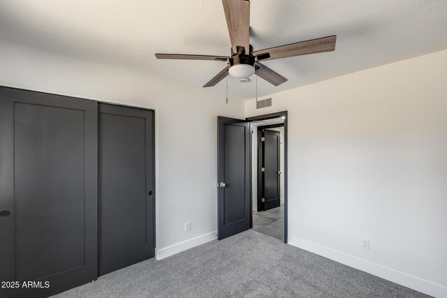 3011 E John Cabot Dr, Phoenix, AZ 85032 - unfurnished bedroom featuring carpet, baseboards, a closet, and a ceiling fan