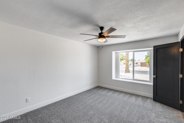 3011 E John Cabot Dr, Phoenix, AZ 85032 - unfurnished room with ceiling fan, carpet flooring, baseboards, and a textured ceiling