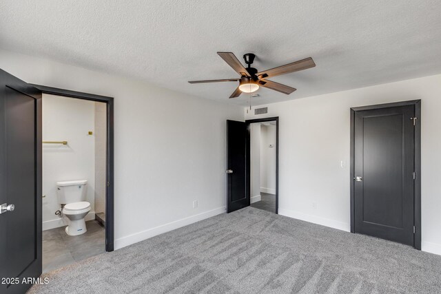 3011 E John Cabot Dr, Phoenix, AZ 85032 - unfurnished bedroom featuring a textured ceiling, baseboards, ensuite bath, and ceiling fan