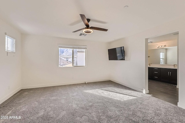 2364 N 212th Ave, Buckeye, AZ 85396 - unfurnished bedroom featuring multiple windows, baseboards, and carpet