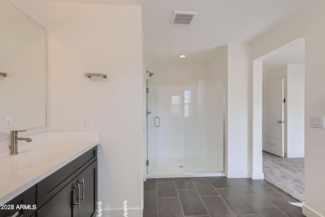 2364 N 212th Ave, Buckeye, AZ 85396 - full bath with tile patterned floors, vanity, a shower stall, and baseboards