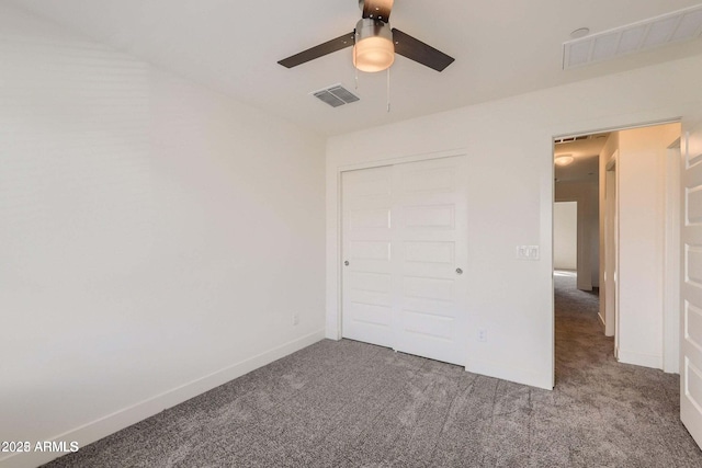 2364 N 212th Ave, Buckeye, AZ 85396 - unfurnished bedroom featuring carpet, baseboards, and a ceiling fan