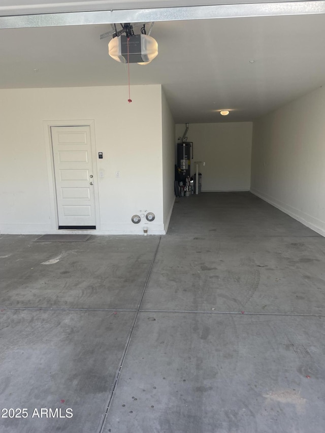 2364 N 212th Ave, Buckeye, AZ 85396 - garage with a garage door opener and gas water heater