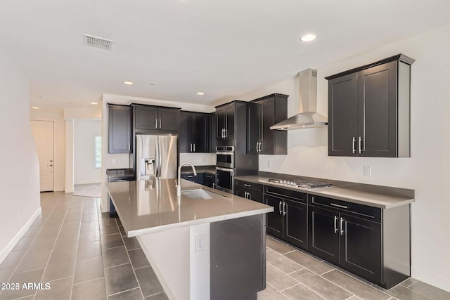 2364 N 212th Ave, Buckeye, AZ 85396 - kitchen with a sink, wall chimney exhaust hood, stainless steel appliances, baseboards, and recessed lighting