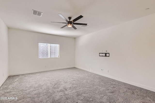 2364 N 212th Ave, Buckeye, AZ 85396 - unfurnished room featuring carpet flooring, a ceiling fan, and baseboards