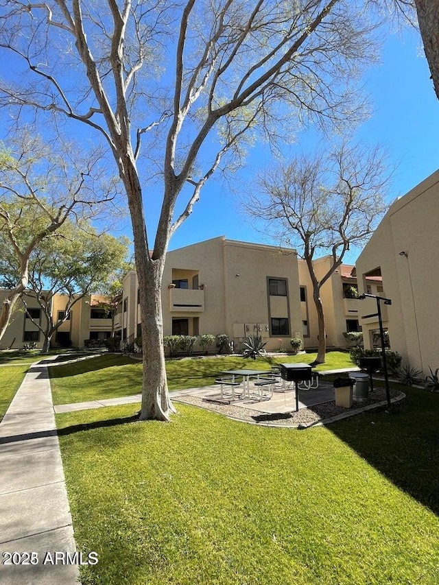 145 N 74th St Unit 125, Mesa, AZ 85207 - view of property's community with a lawn