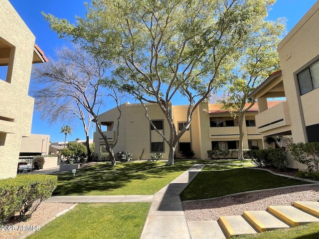 145 N 74th St Unit 125, Mesa, AZ 85207 - view of community with a lawn