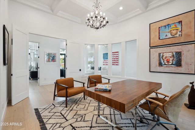 office featuring beam ceiling, coffered ceiling, light hardwood / wood-style floors, and a towering ceiling