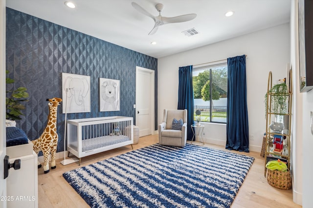 bedroom with wood-type flooring and ceiling fan