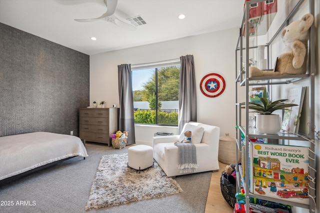 bedroom featuring hardwood / wood-style flooring and ceiling fan