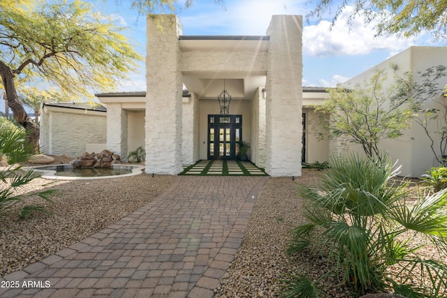 entrance to property featuring french doors