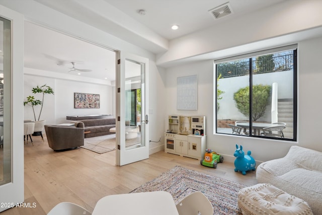 living room featuring hardwood / wood-style flooring and french doors