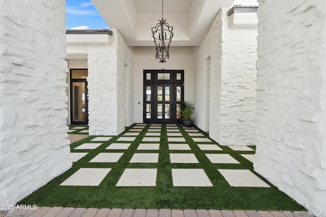 view of exterior entry featuring french doors