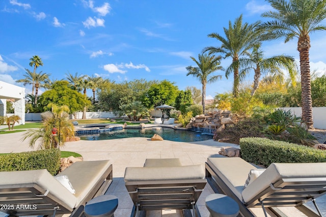 view of swimming pool featuring an in ground hot tub and a patio