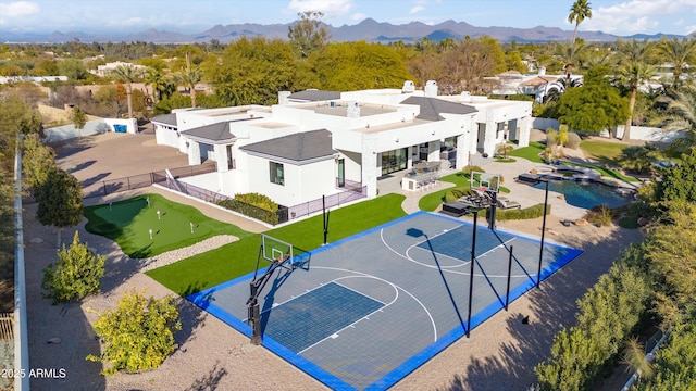 view of basketball court with a mountain view