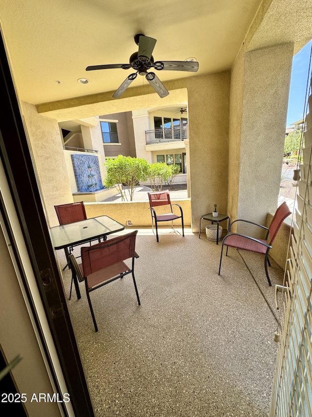 view of patio / terrace featuring a balcony and ceiling fan