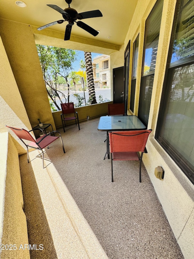 exterior space with a ceiling fan
