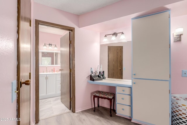 bathroom featuring vanity and wood-type flooring