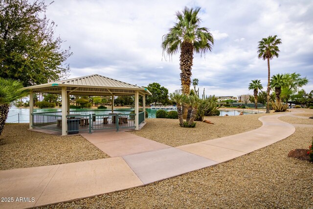 view of property's community featuring a gazebo and a water view