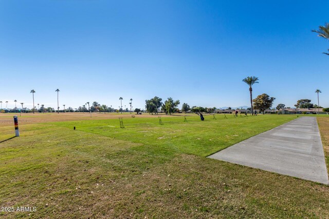 view of home's community with a lawn