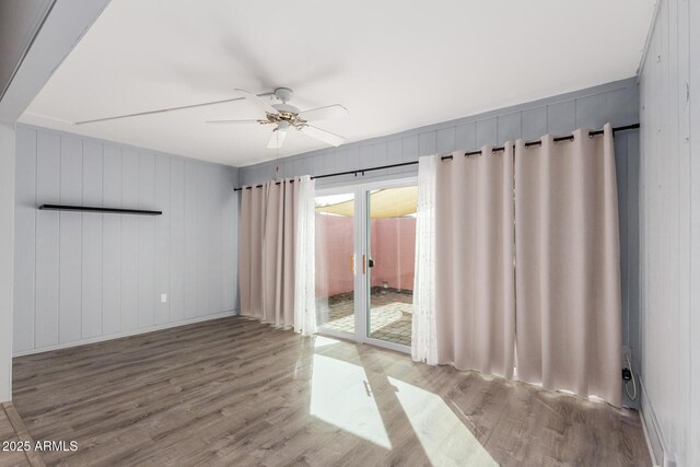 spare room featuring ceiling fan and light wood-type flooring