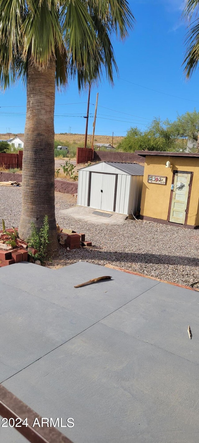 exterior space with a shed