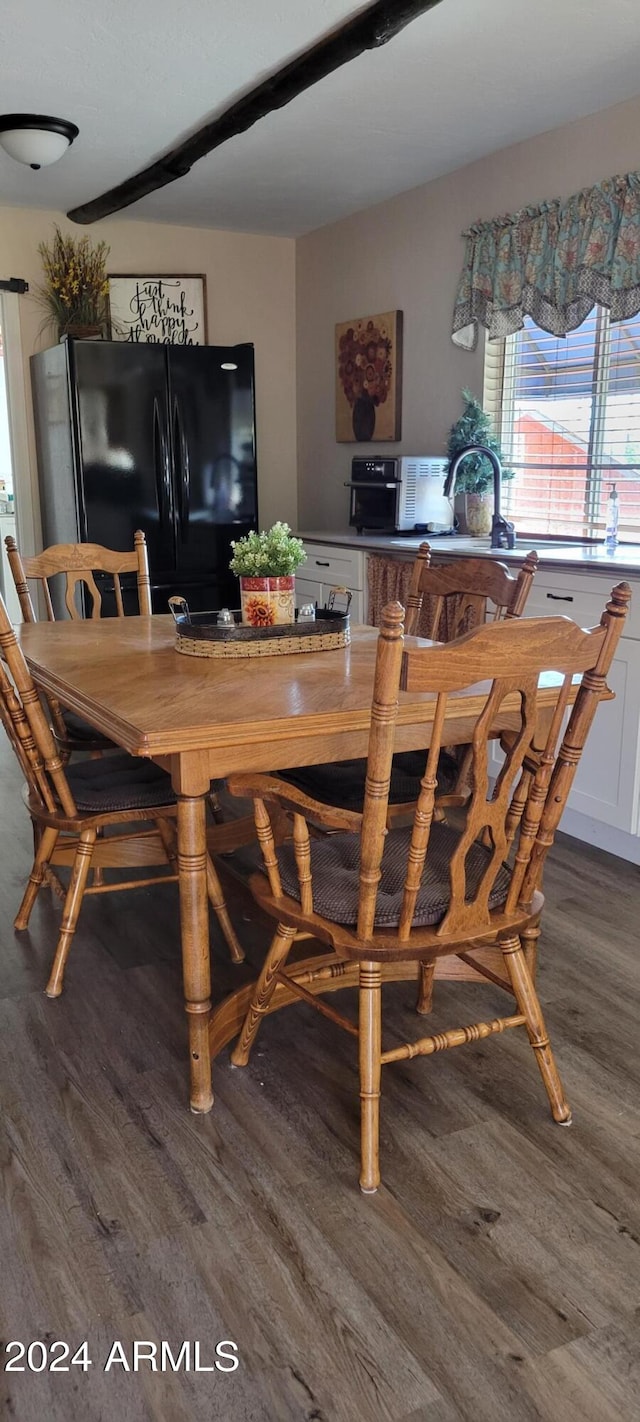 dining space with dark wood-type flooring