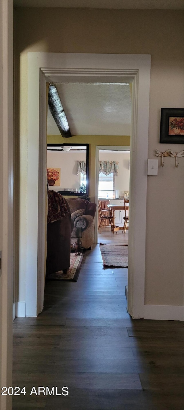 hallway with wood-type flooring