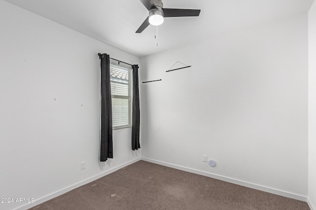 spare room featuring carpet flooring and ceiling fan