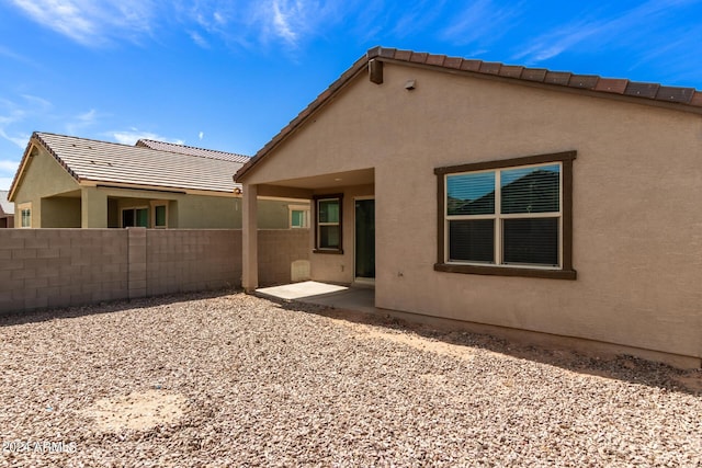 rear view of house featuring a patio