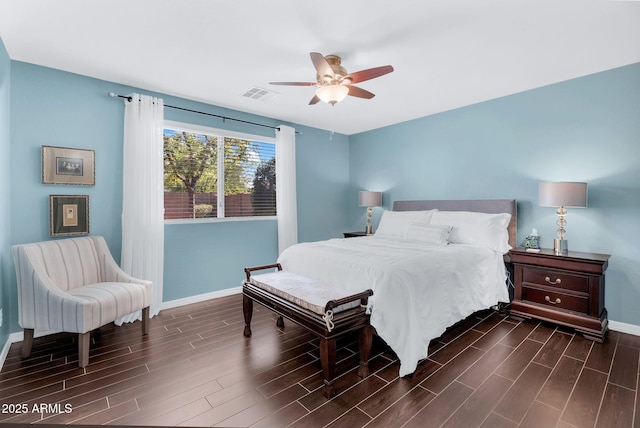 bedroom featuring dark wood-type flooring, baseboards, and ceiling fan