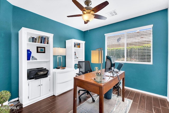 office space featuring dark wood-style floors, ceiling fan, and baseboards