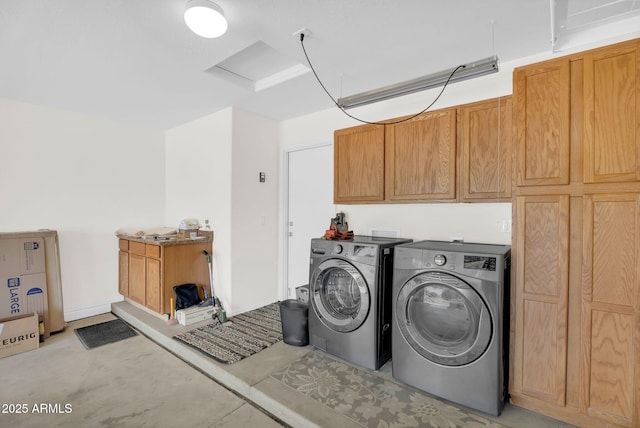 laundry room with cabinet space and independent washer and dryer