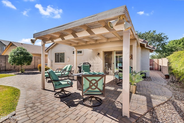 view of patio / terrace featuring a pergola and a fenced backyard