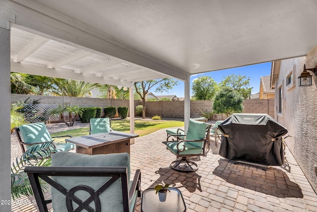 view of patio featuring a grill and a fenced backyard