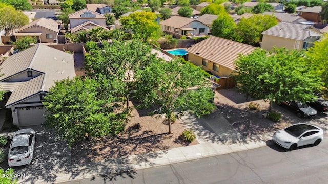 aerial view of residential area featuring a pool area