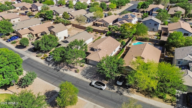 aerial perspective of suburban area featuring a pool area