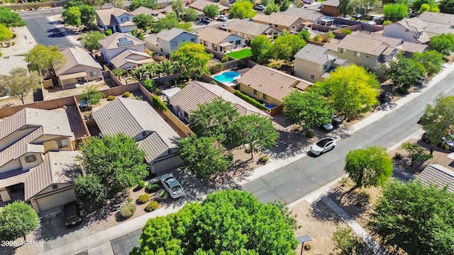 aerial perspective of suburban area featuring a pool area