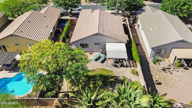 aerial view of property and surrounding area with a pool