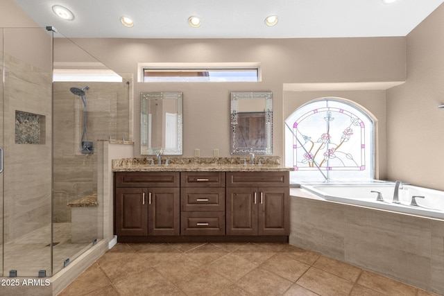 bathroom with vanity, tile patterned flooring, and shower with separate bathtub