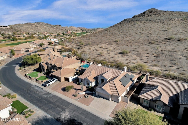 birds eye view of property featuring a mountain view