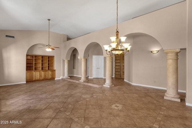 unfurnished dining area with ornate columns, built in shelves, and ceiling fan