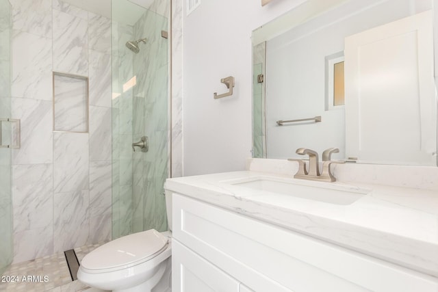 4302 N 80th Ln, Phoenix, AZ 85033 - bathroom featuring vanity, a marble finish shower, and toilet