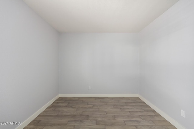 4302 N 80th Ln, Phoenix, AZ 85033 - empty room with wood finished floors and baseboards