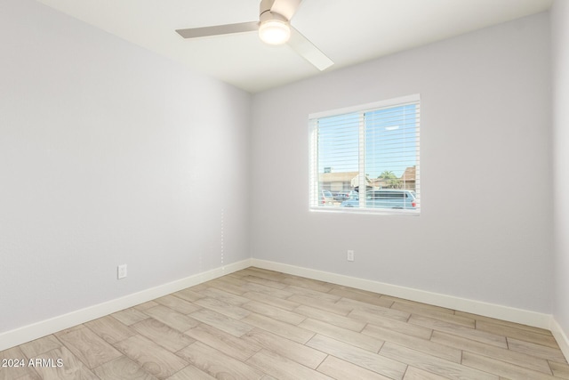 4302 N 80th Ln, Phoenix, AZ 85033 - unfurnished room featuring light wood-style floors, ceiling fan, and baseboards