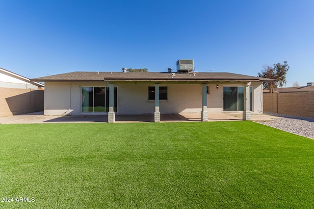 4302 N 80th Ln, Phoenix, AZ 85033 - back of house with a patio area and central AC unit
