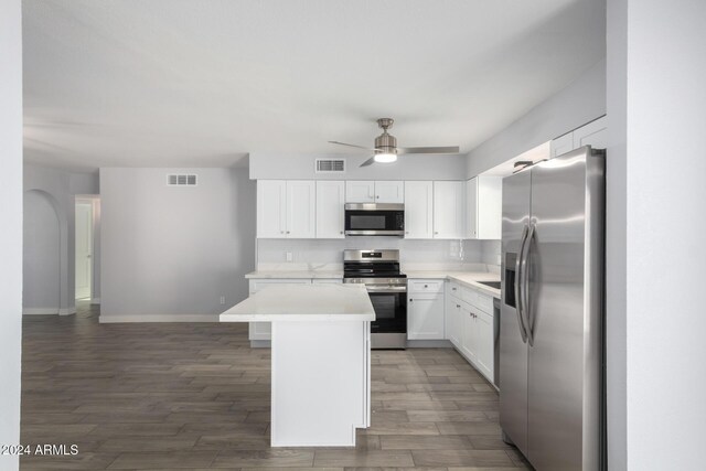4302 N 80th Ln, Phoenix, AZ 85033 - kitchen featuring appliances with stainless steel finishes, wood finished floors, light countertops, ceiling fan, and baseboards
